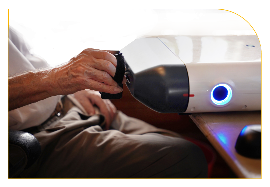 Patient using ReHandyBot for hand rehabilitation